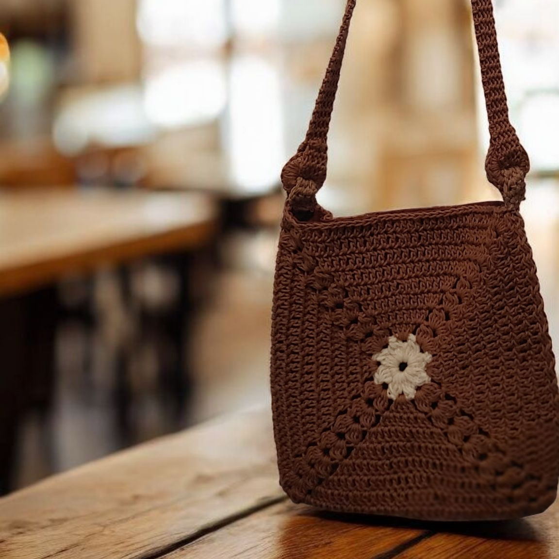 Brown crochet granny square hands free bag.