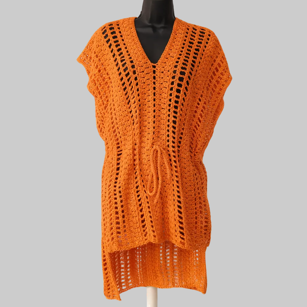 Handmade coral crochet beach cover-up with open-knit design displayed on mannequin, lightweight summer swim cover-up