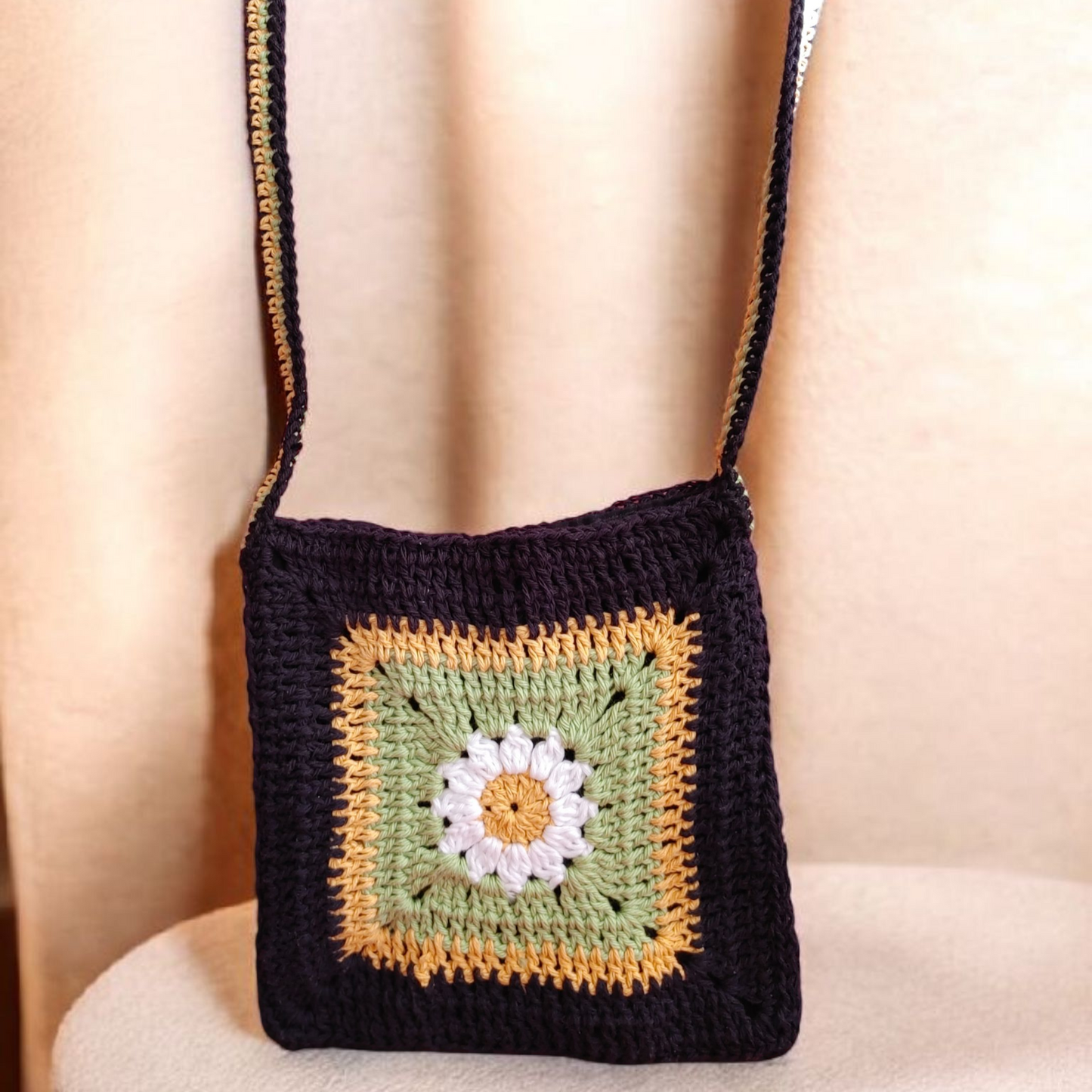 Crochet granny square floral hands free bag.