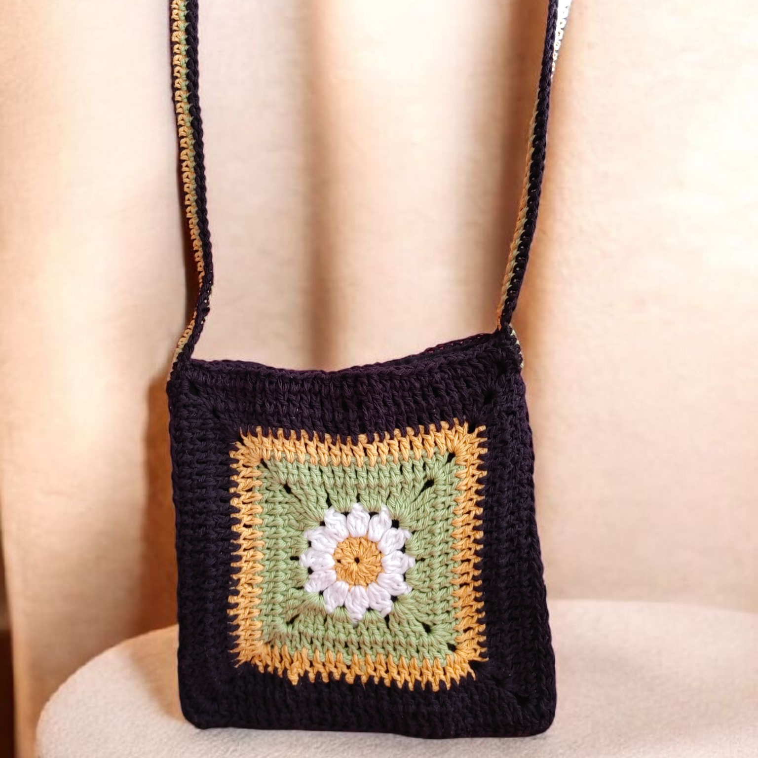 Crochet granny square floral hands free bag.