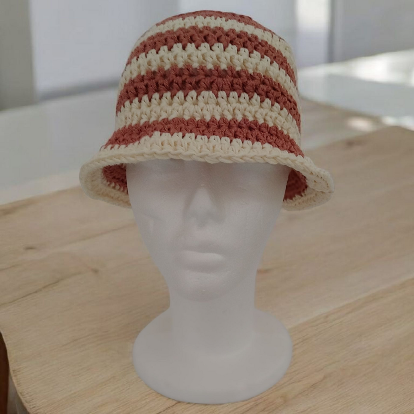 Bronze a d cream striped crochet bucket hat.