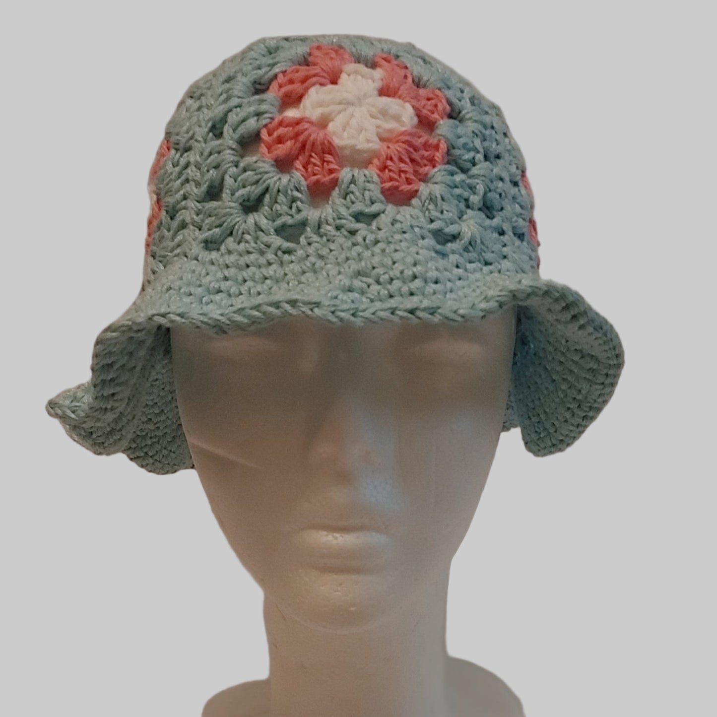 Crochet light blue and pink granny square bucket hat.