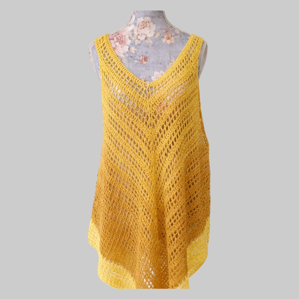 Handmade golden ombre crochet beach cover-up displayed on dress form, lightweight sleeveless summer cover-up