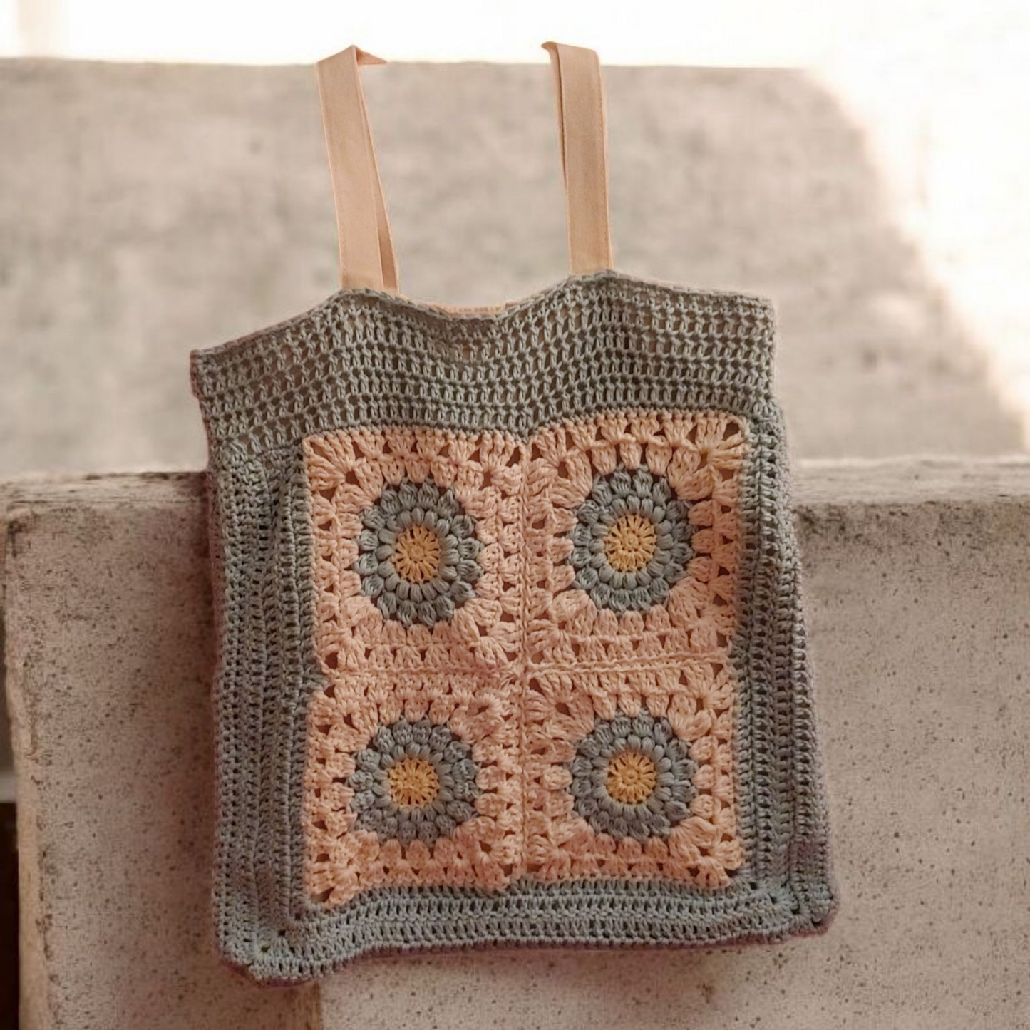 Crochet green and cream floral Eco-Tote with a granny floral center pattern.