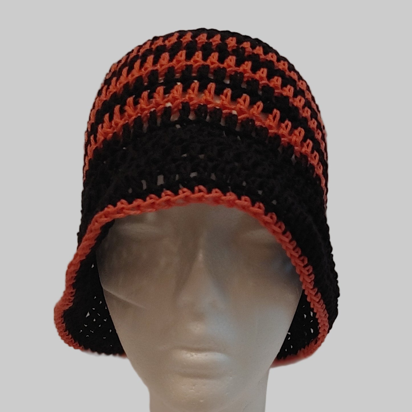 Black and coral striped crochet bucket hat.